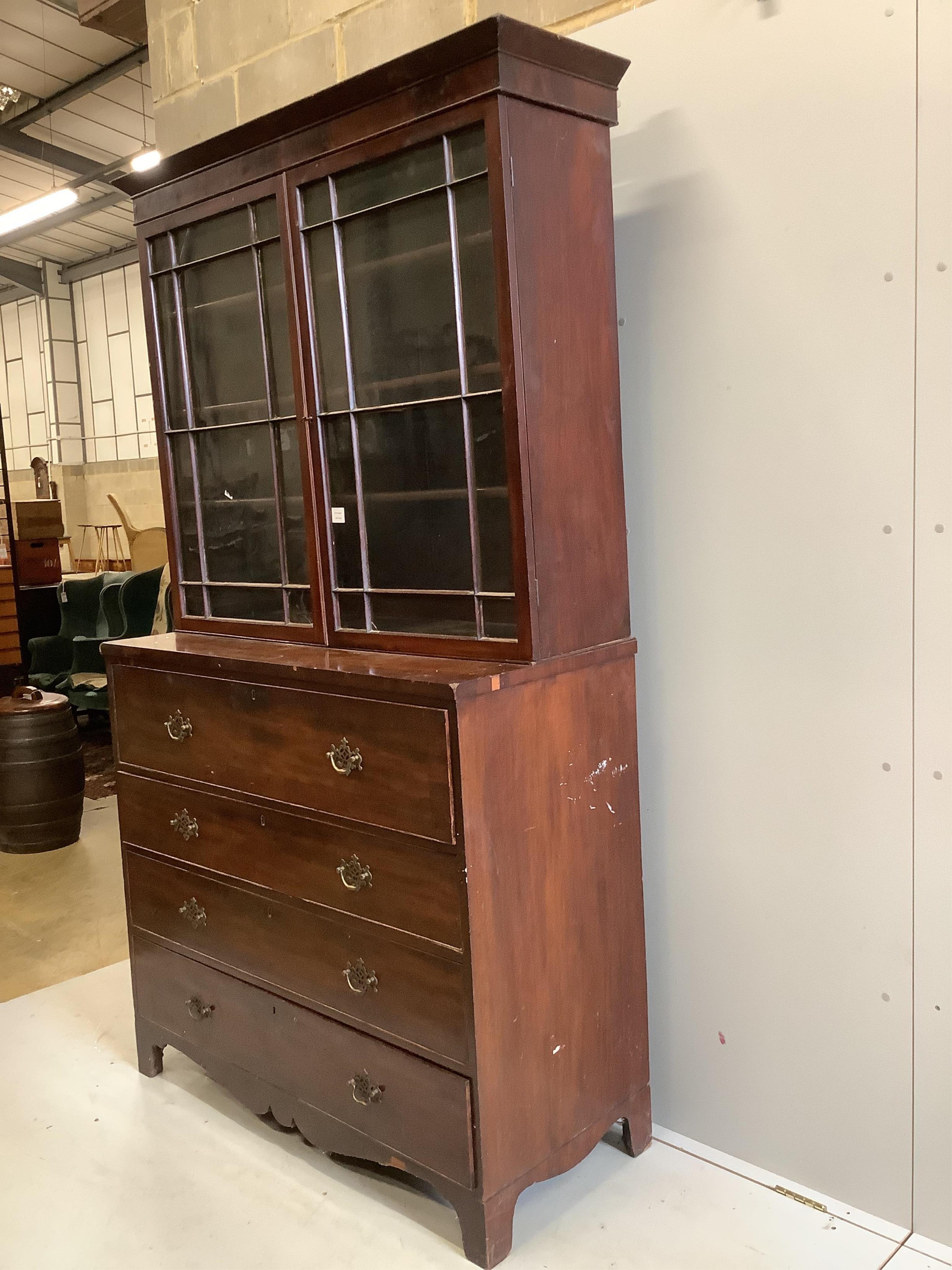 A Regency mahogany secretaire chest, with a later glazed bookcase over, width 121cm, depth 53cm, height 221cm. Condition - poor